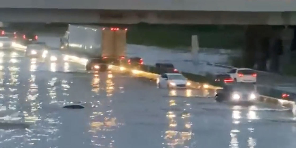 Flooding on highway with cars submerged